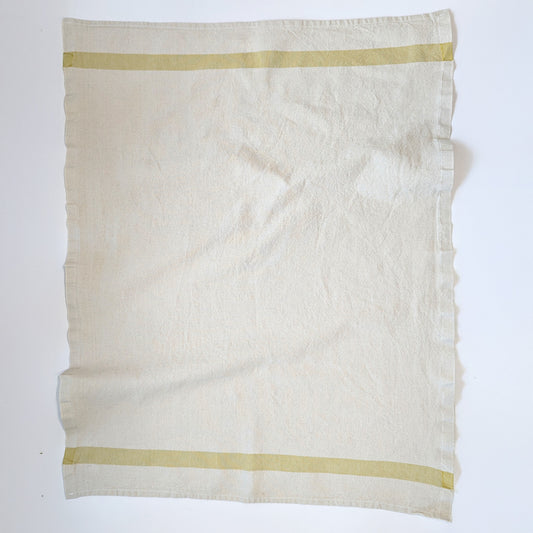 Charvet Éditions Phenix kitchen towel in Bergamot colorway laid flat showing woven citrus stripe detail