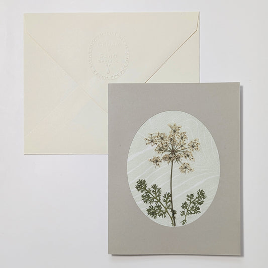 Handmade Suminagashi notecard featuring pressed yarrow flower with detailed foliage on marbled Hosho paper and embossed envelope