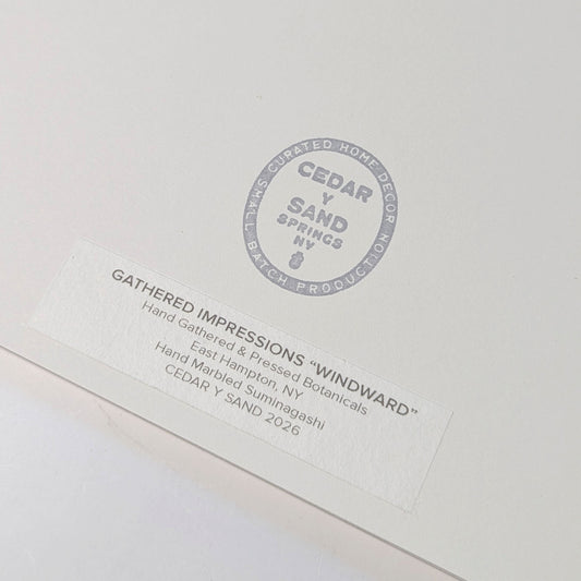 Reverse of Windward botanical artwork showing the CEDAR Y SAND studio stamp and Gathered Impressions label identifying hand-gathered East Hampton botanicals and hand-marbled Suminagashi, 2026.