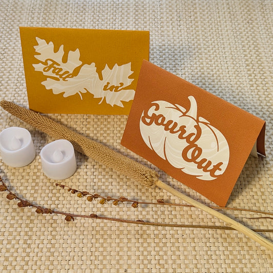 Artisan-made pumpkin and leaf lantern cards with 2 LED tealights, part of the “Gourd Out & Fallin’” autumn notecard duo by CEDAR Y SAND.
