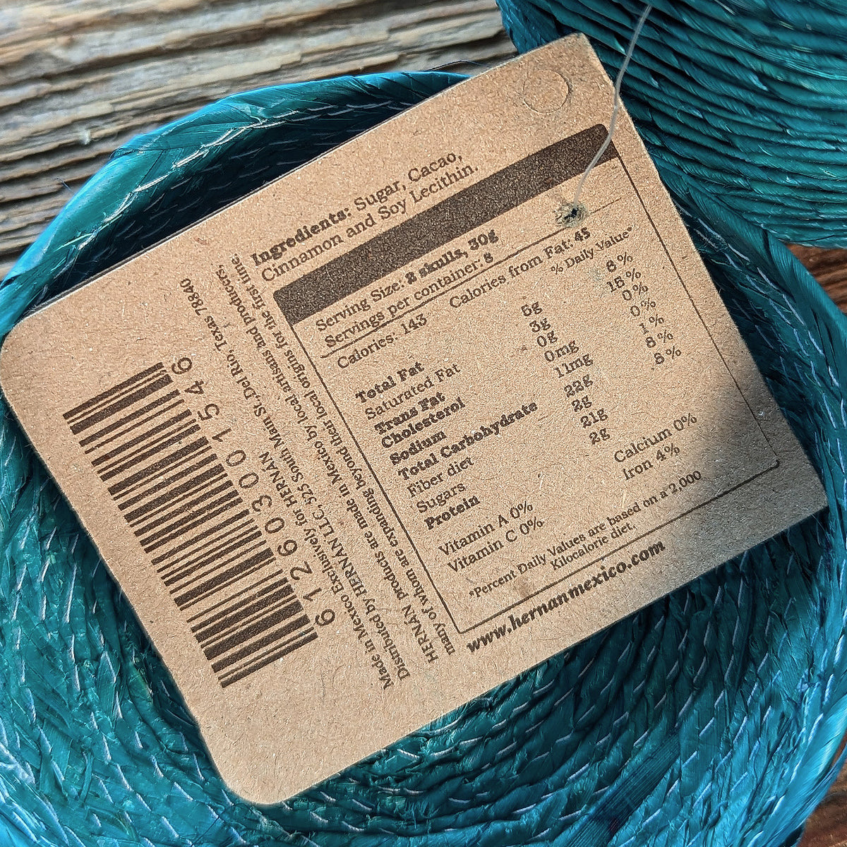 close up of label indicating Ingredients of Sugar, cacao, cinnamon and soy lecithin
