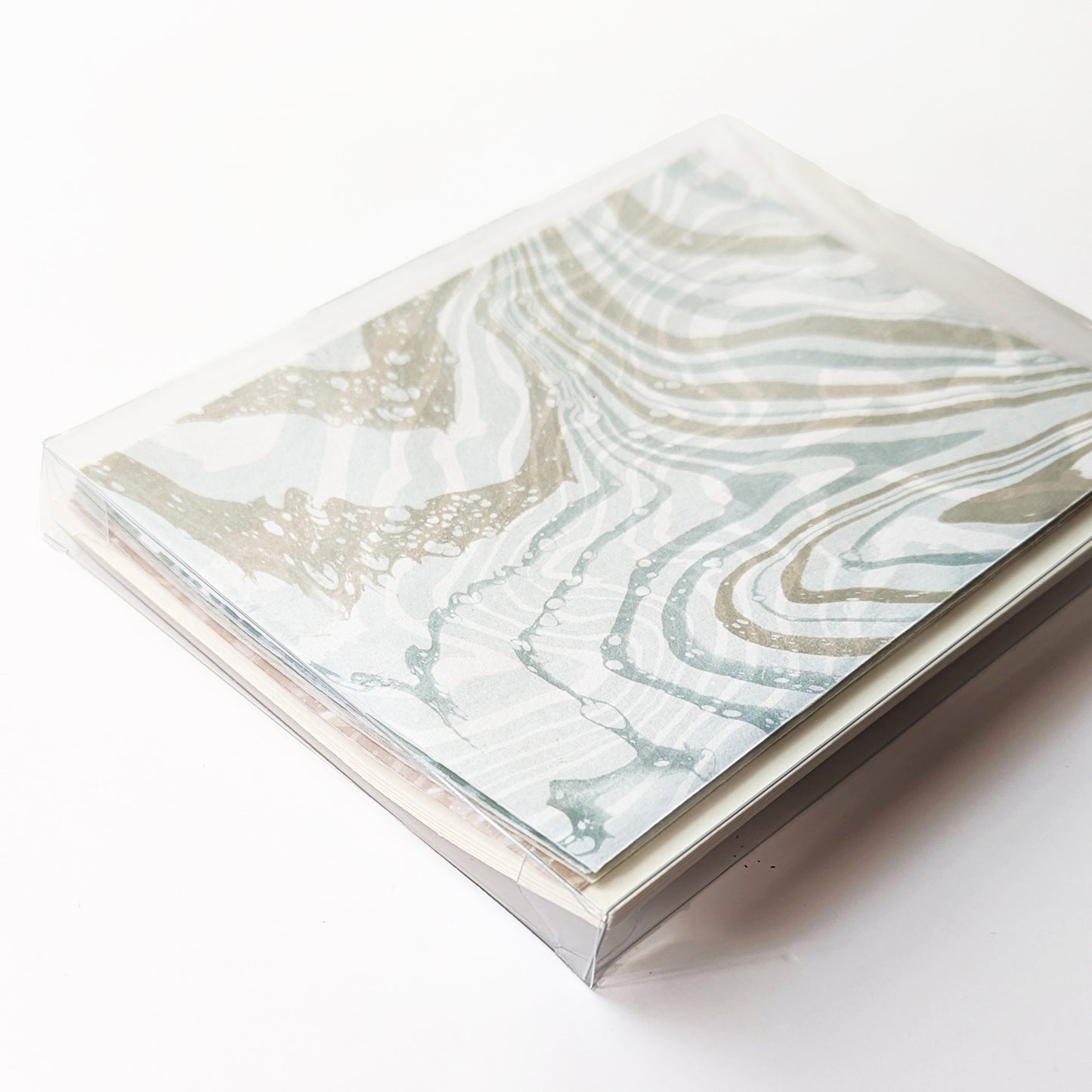 Boxed Coastal Hues notecard set, featuring marbled Ditch Plains design on top, packaged for gifting.
