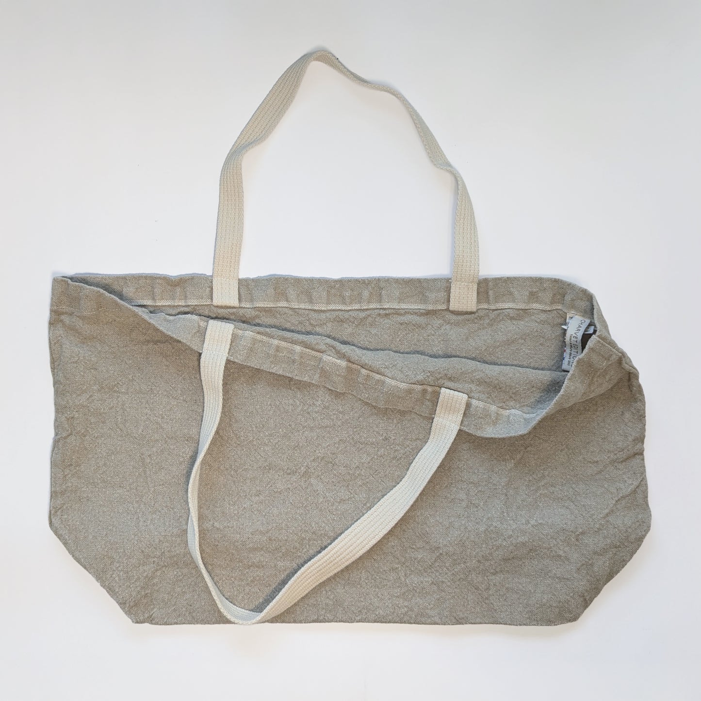Open view of Doudou linen tote showing spacious interior and soft structured body