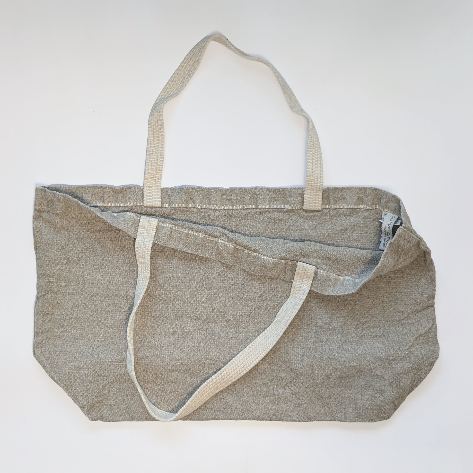 Open view of Doudou linen tote showing spacious interior and soft structured body