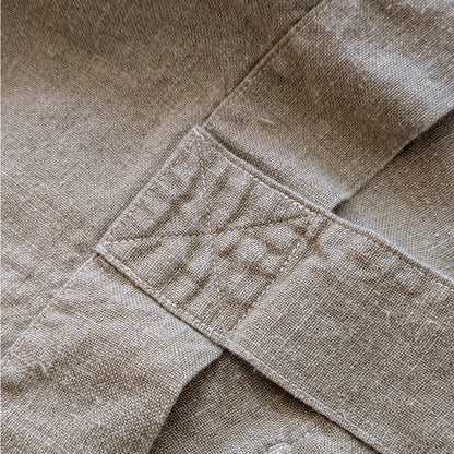 Close-up detail of reinforced stitching on natural linen Escapade tote handle attachment