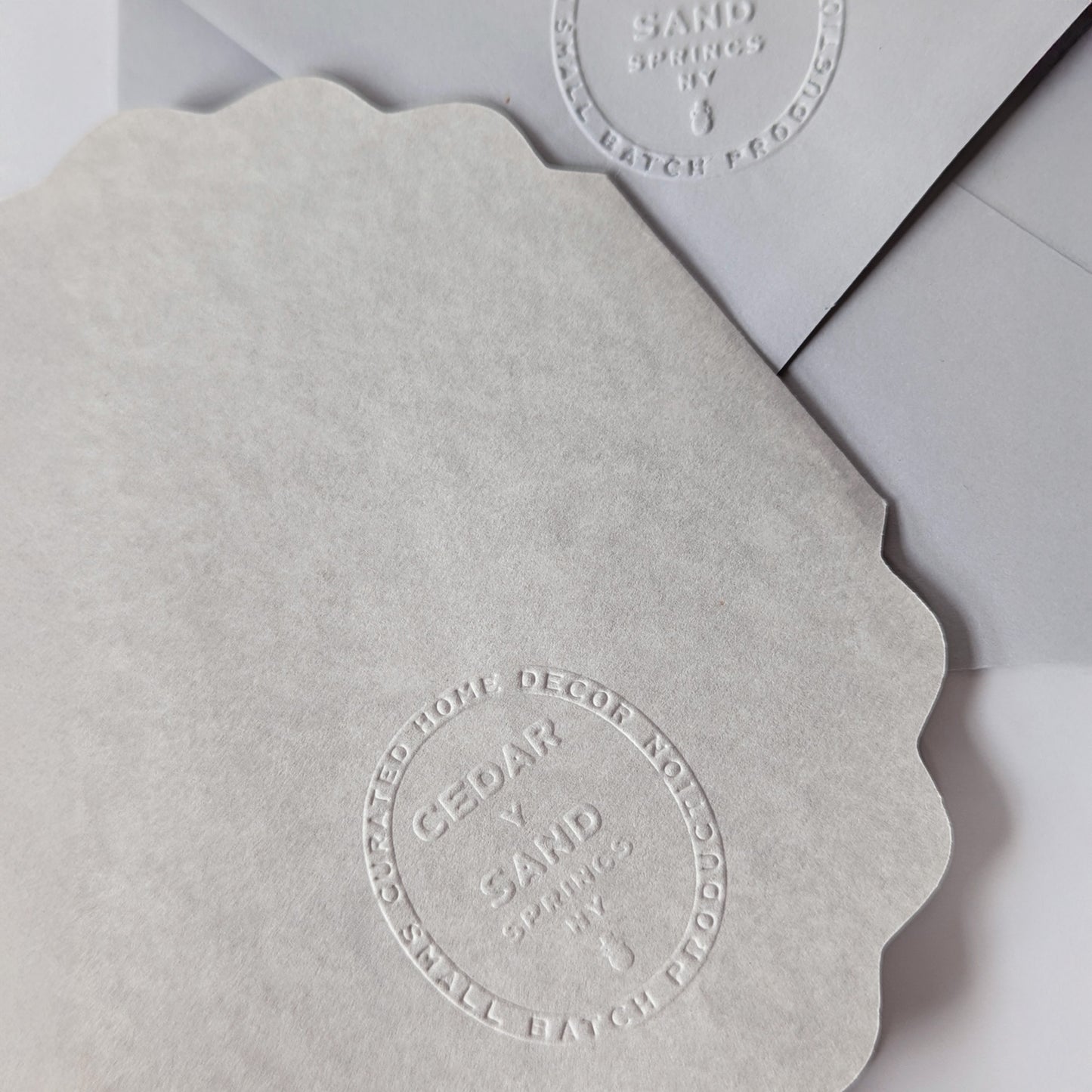 Flora of Affection lavender notecard and envelope with blind-embossed CEDAR Y SAND mark