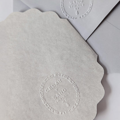 Flora of Affection lavender notecard and envelope with blind-embossed CEDAR Y SAND mark