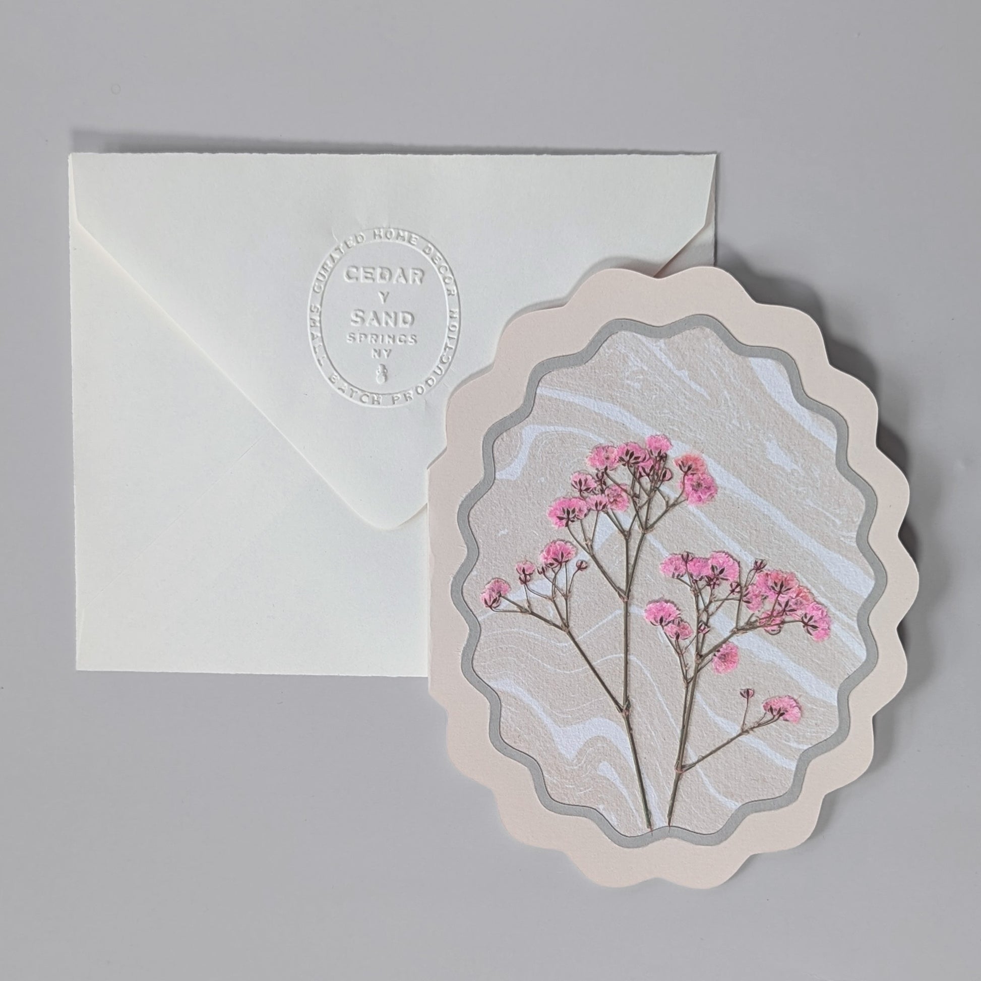 Flora of Affection notecard in Petal colorway with pressed pink florals on hand-marbled Suminagashi washi paper