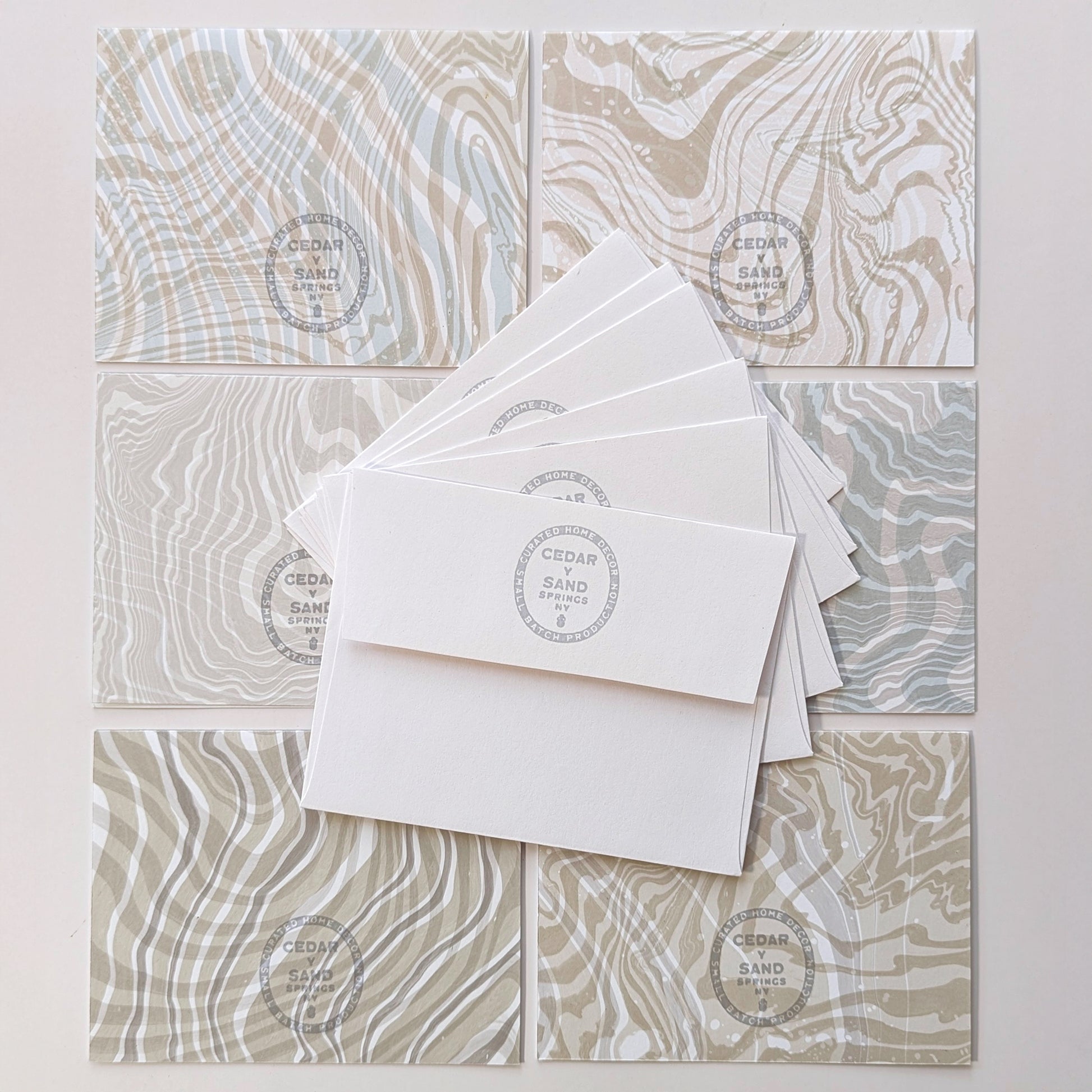 back side of notecards & envelops with Cedar Y Sand insignia rubber stamp
