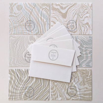 back side of notecards & envelops with Cedar Y Sand insignia rubber stamp