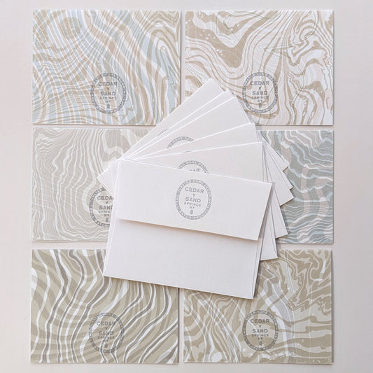 back side of notecards & envelops with Cedar Y Sand insignia rubber stamp