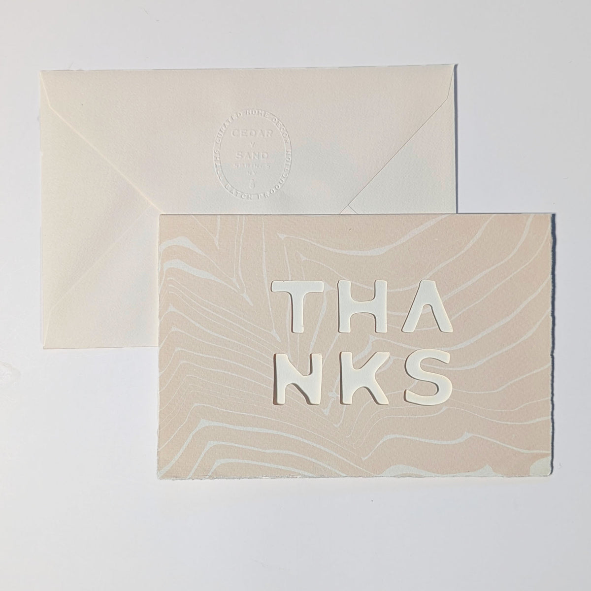 Handmade Thanks Notecard in Blush with delicate pink-beige Suminagashi patterns, deckled edges and dimensional cut-out lettering.
