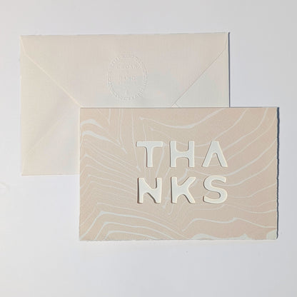Handmade Thanks Notecard in Blush with delicate pink-beige Suminagashi patterns, deckled edges and dimensional cut-out lettering.