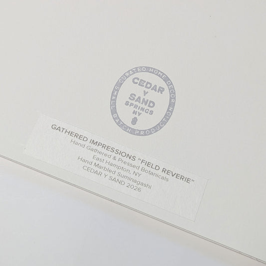 Reverse of Field Reverie artwork showing the CEDAR Y SAND studio stamp and Gathered Impressions label documenting hand-gathered East Hampton botanicals and Suminagashi.