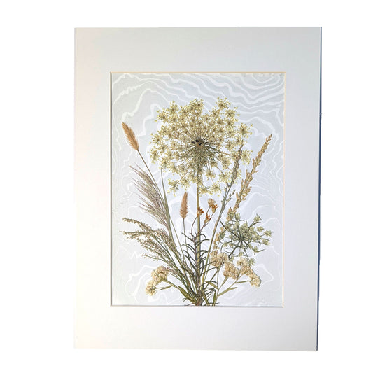 Field Reverie original pressed botanical artwork with delicate ivory wildflowers and grasses over pale hand-marbled Suminagashi, presented in a white 12 x 16 inch mat.