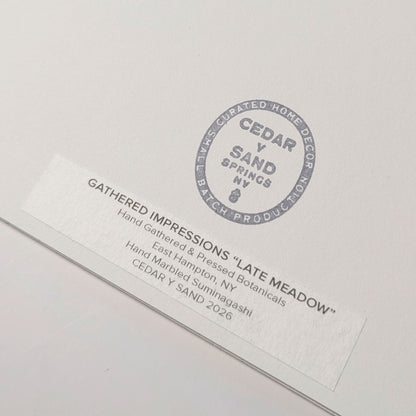 Back of Late Meadow with CEDAR Y SAND studio stamp and Gathered Impressions label identifying hand-gathered and pressed East Hampton botanicals.