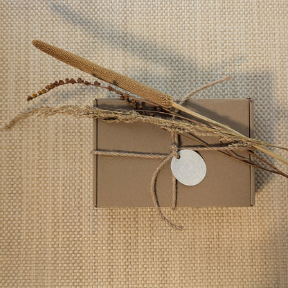 Close-up of the kraft gift box packaging for the “Gourd Out & Fallin’” lantern card set, tied with jute string and Cedar Y Sand hang tag.