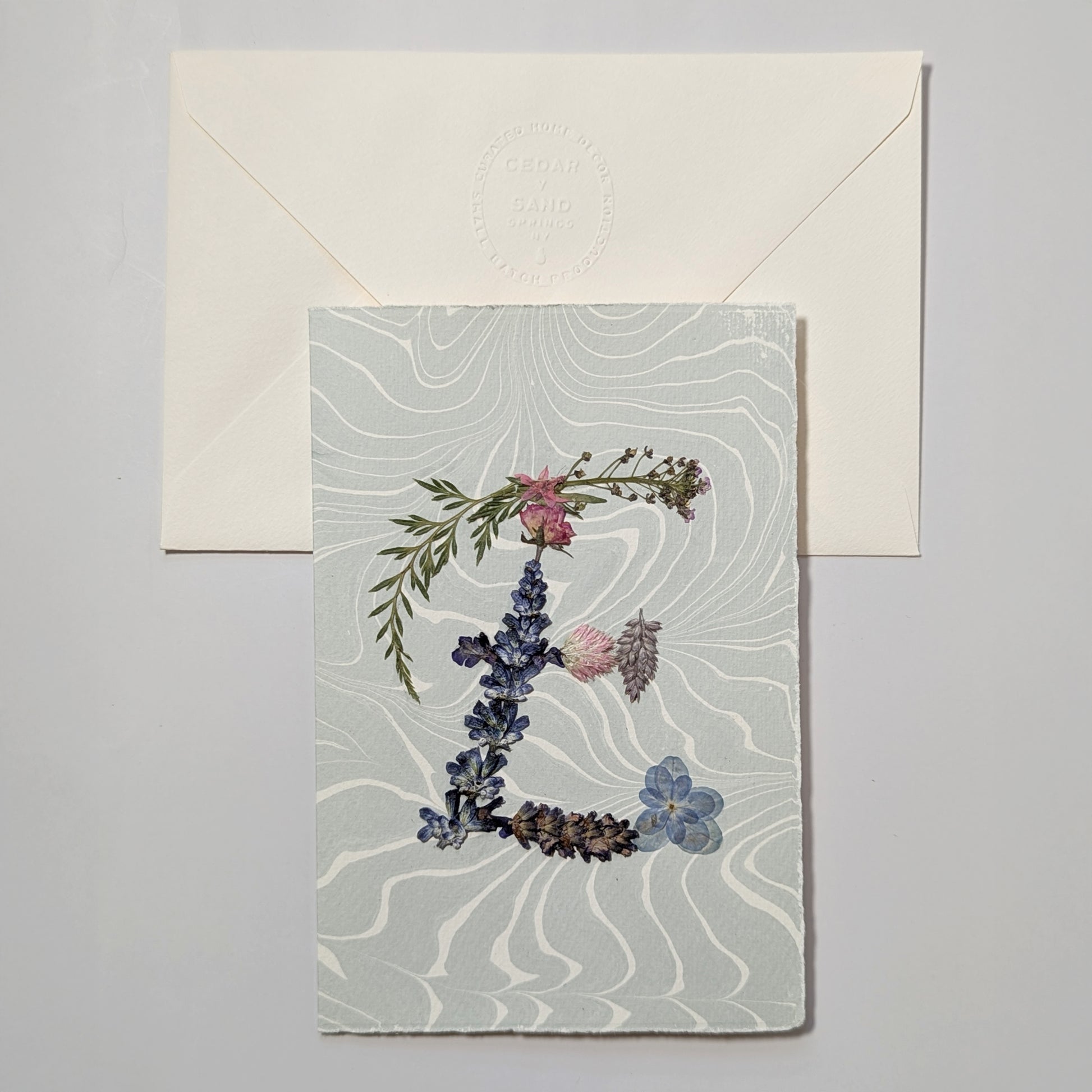 Pressed flower letter E notecard on soft blue Suminagashi paper with envelope, handmade botanical letter card
