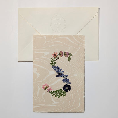 Pressed floral letter S notecard on marbled Suminagashi paper with envelope, handmade botanical initial stationery