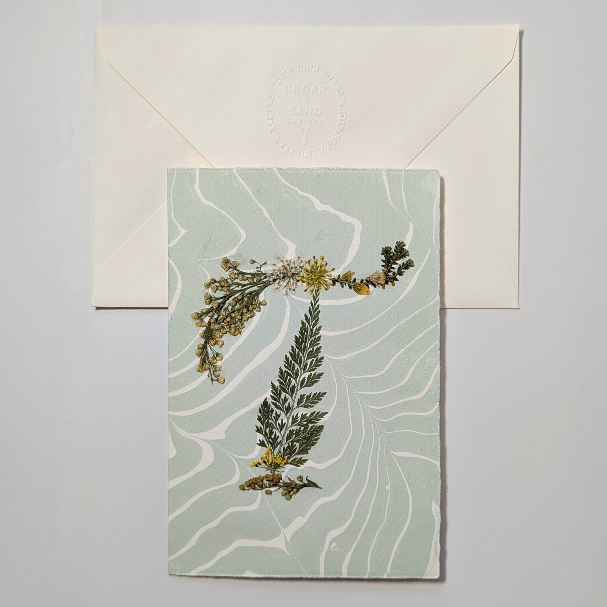 Pressed botanical letter T notecard on pale green Suminagashi paper with envelope, handmade floral initial card