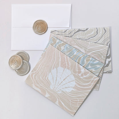 Group photo of Marine Fauna Sea Life notecards with matching envelopes and Cedar Y Sand wax seals.