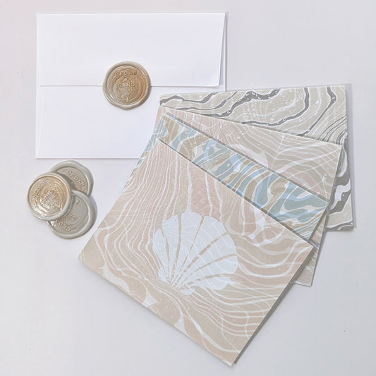 Group photo of Marine Fauna Sea Life notecards with matching envelopes and Cedar Y Sand wax seals.