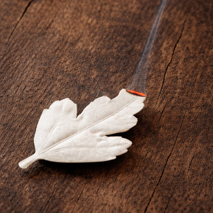 HA KO Agarwood paper leaf incense burning on rustic wooden surface, Japanese incense ritual by Kunjudo