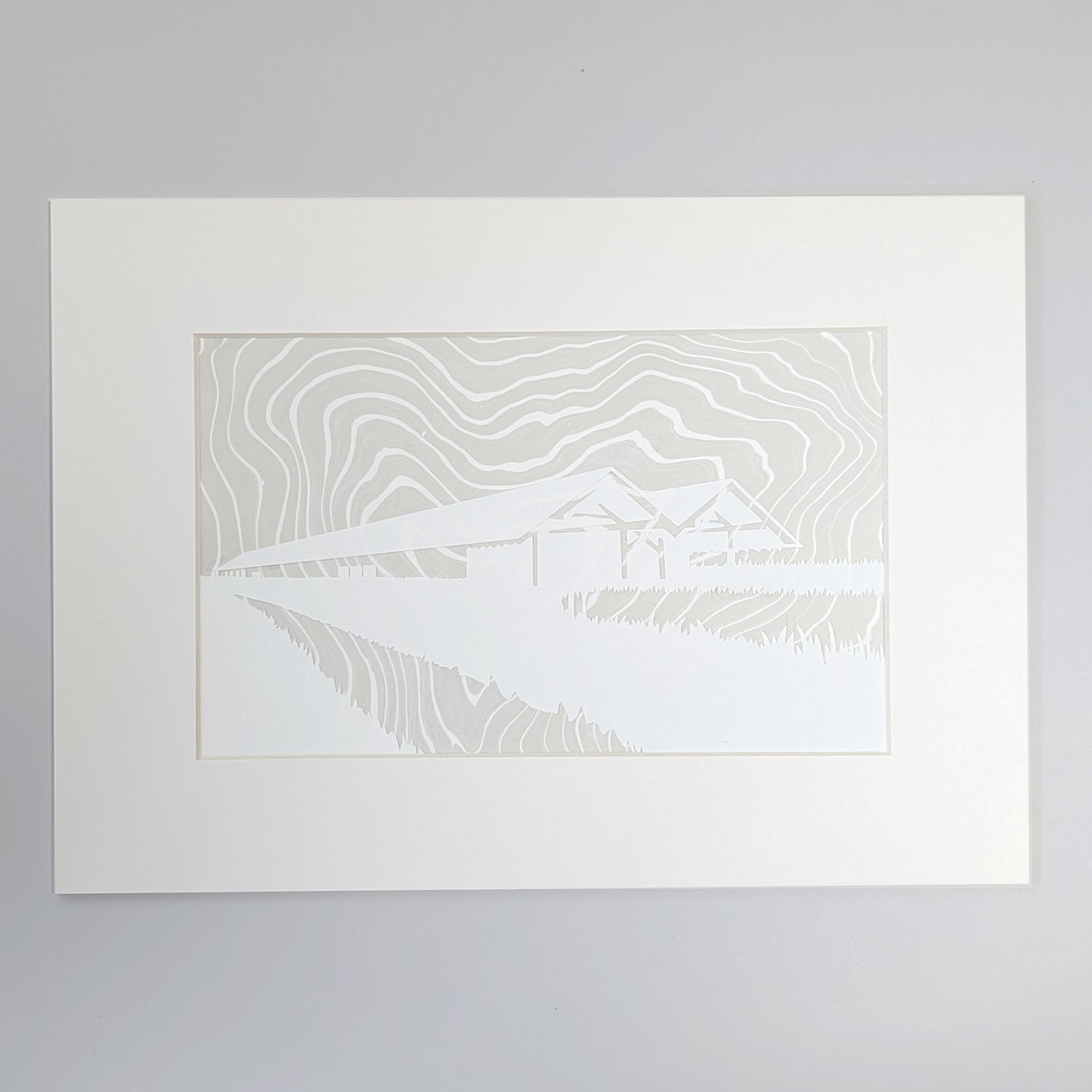 Contoured gray suminagashi marbling behind a crisp paper silhouette of the Parrish Art Museum, matted and ready to frame.