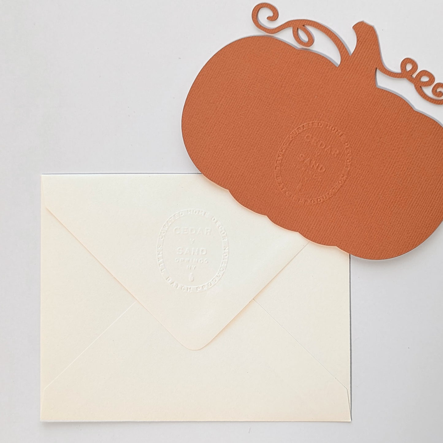 Back of Pumpkin Lattice Notecard and envelope featuring embossed CEDAR Y SAND mark.