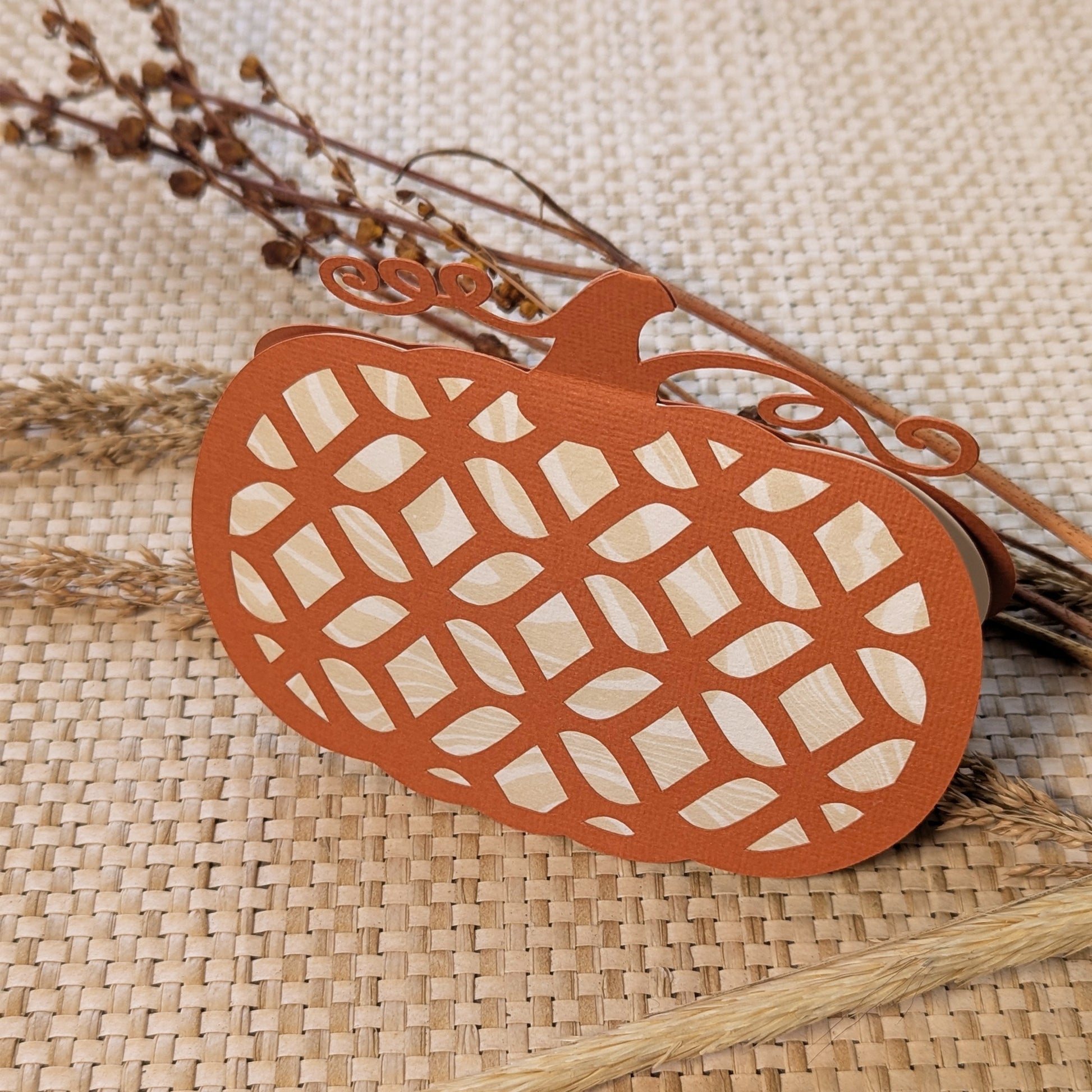 Pumpkin Lattice Notecard displayed with dried fall stems on textured woven background.