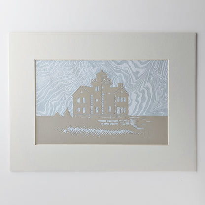 Cedar Point Lighthouse silhouette in dune-toned paper, layered over hand-marbled foggy blue-gray suminagashi background, matted in off white.