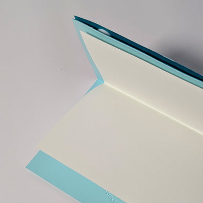 Interior of Surfin’ Flipper notecard with blank liner insert for writing.