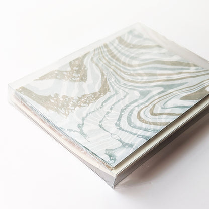 Boxed Coastal Hues notecard set, featuring marbled Ditch Plains design on top, packaged for gifting.